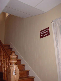 Directions, Inc stairway to office with sign